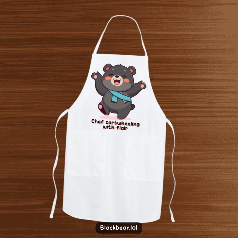 Funny black bear cub apron, a smiling cub with a sash, performing a cartwheel, adding energetic humor to kitchen duties.