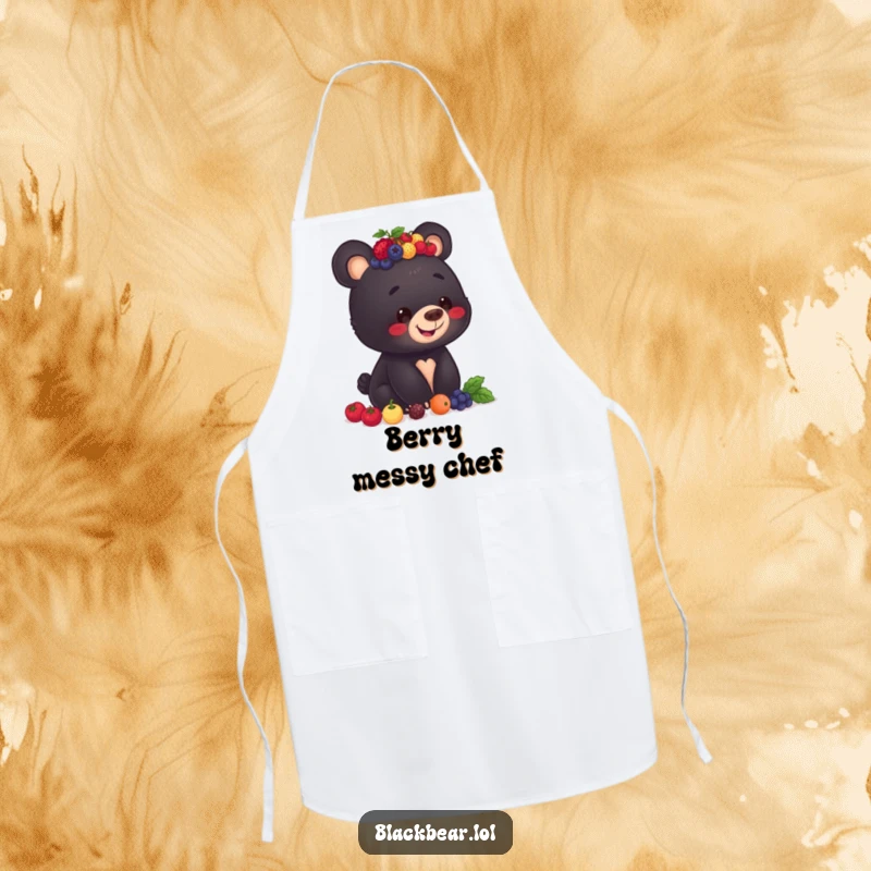 Funny apron showing a black bear cub with a smile, balancing a stack of berries on its head, ready for kitchen duties.