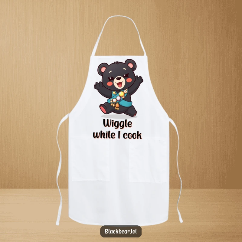 Funny apron of a black bear cub in a jeweled sash, performing a silly dance, adding humor to kitchen duties.