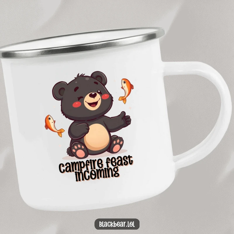 Funny camping mug with a smiling black bear cub juggling fish with a bewildered expression, durable and humorous.