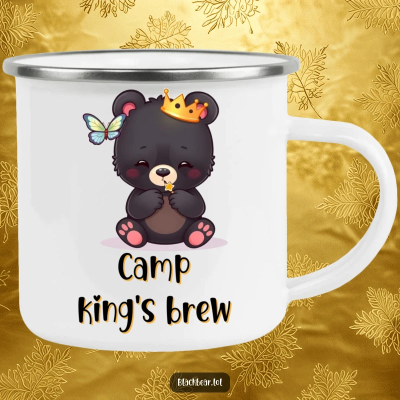 Funny camping mug featuring a black bear cub wearing a crown, playfully batting at a butterfly, perfect for adventurous souls.