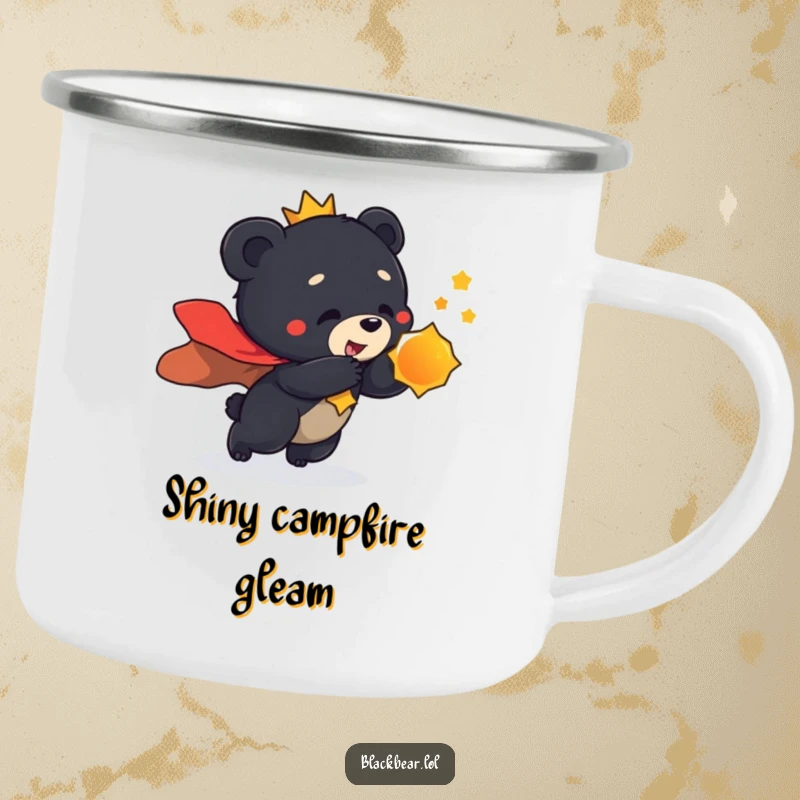 Funny camping mug featuring a black bear cub in a regal cape, playfully lunging towards a shiny object, ready for adventure.