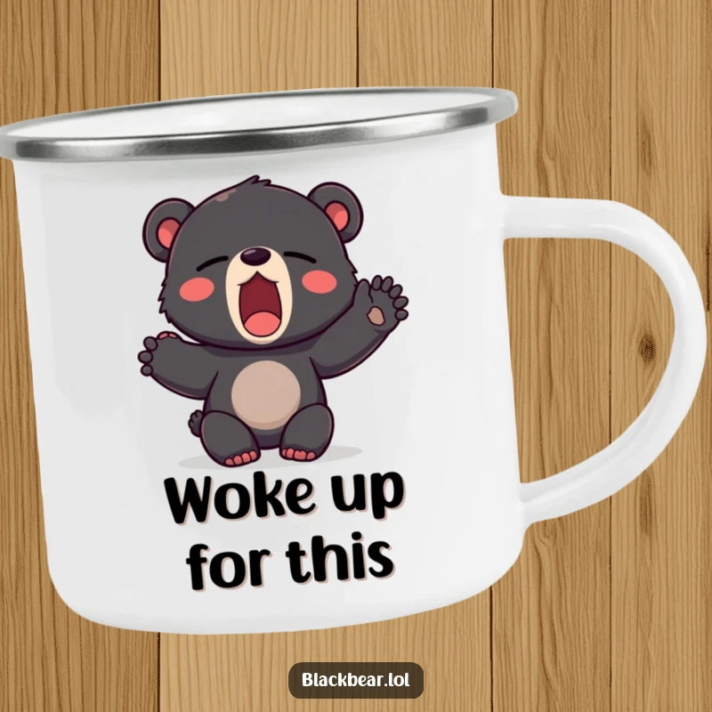 Funny camping mug showing a black bear cub yawning widely and stretching a paw, ready for a leisurely outdoor experience.