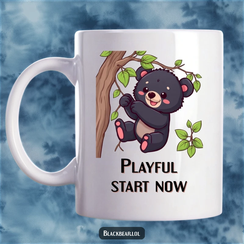 Funny black bear cub mug showing a playful cub tugging on a dangling vine with a mischievous look, great gift.