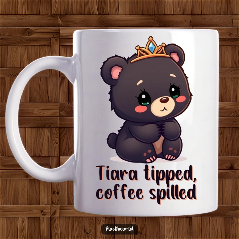 Funny black bear cub mug with a tiara askew, looking confusedly delighted, a perfectly charming gift.