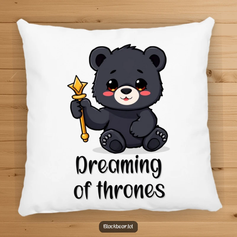 Funny black bear cub pillow holding a shiny scepter with a paw, soft and regal comfort.