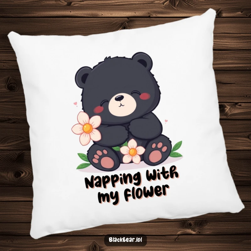 Funny pillow with a content black bear sitting peacefully, holding a large flower, offering comfort and a sense of calm.
