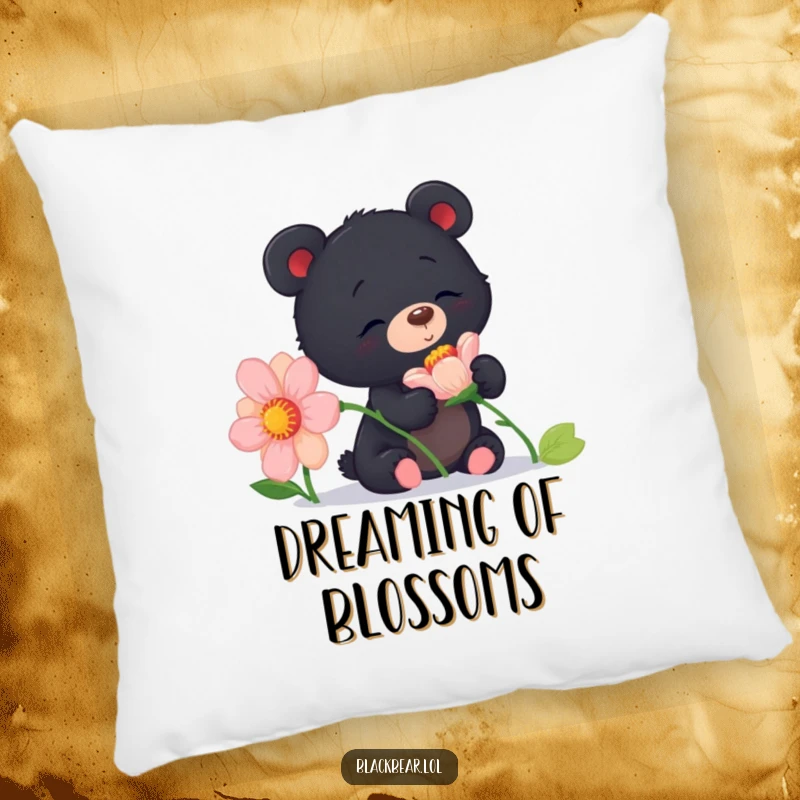 Funny curious black bear cub pillow showing a cub sniffing a large flower with delight, offering cozy comfort and natural charm.
