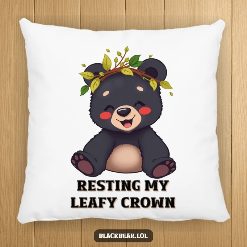 Funny pillow featuring a giggling black bear cub wearing a crown of leaves and twigs, perfect for cozy comfort.