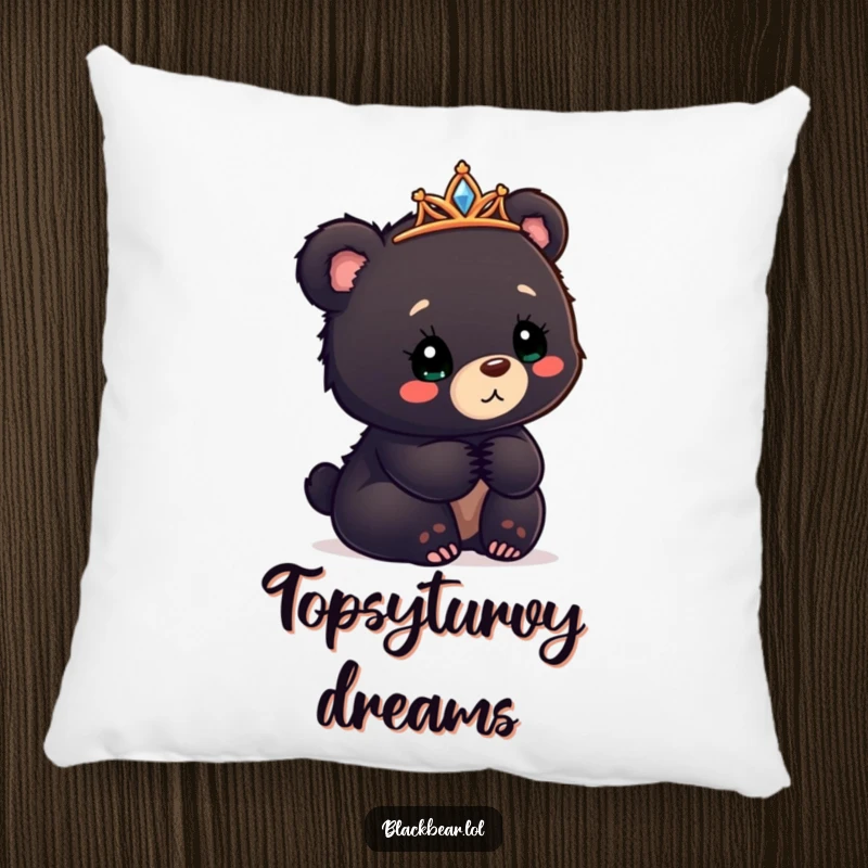 Funny black bear cub pillow with a tiara askew, looking confusedly delighted, soft and cuddly comfort.