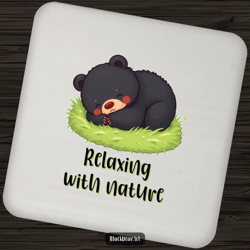 Funny drink coaster featuring a black bear cub happily rolling in soft moss, adding charming protection to tables.