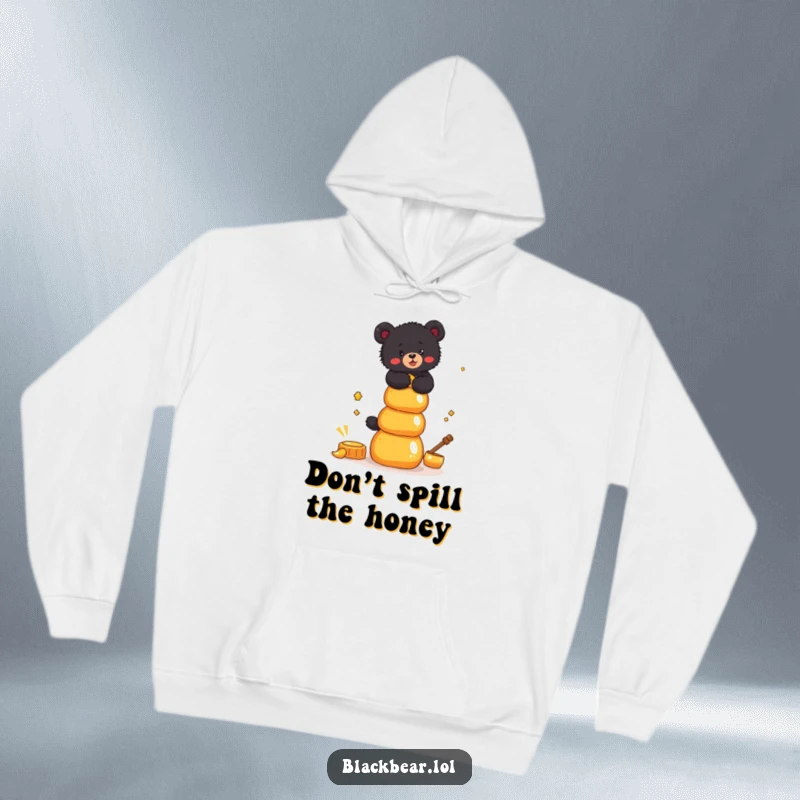 Funny Hoodie featuring a black bear cub trying to balance a precarious stack of honey pots, evoking determination and humor.