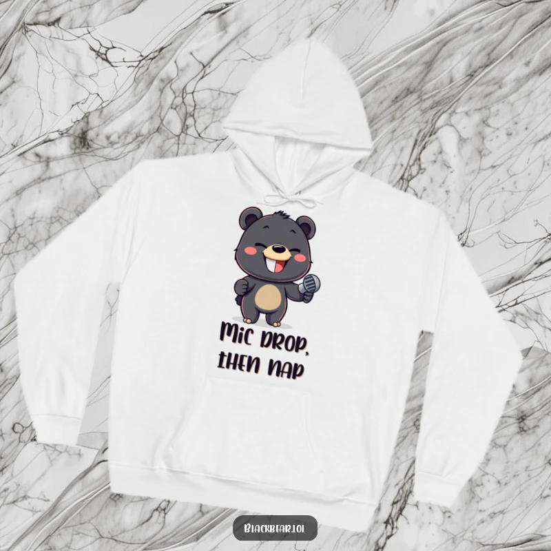 Funny hoodie showcasing a mischievous black bear cub holding a microphone with a confident, playful expression.
