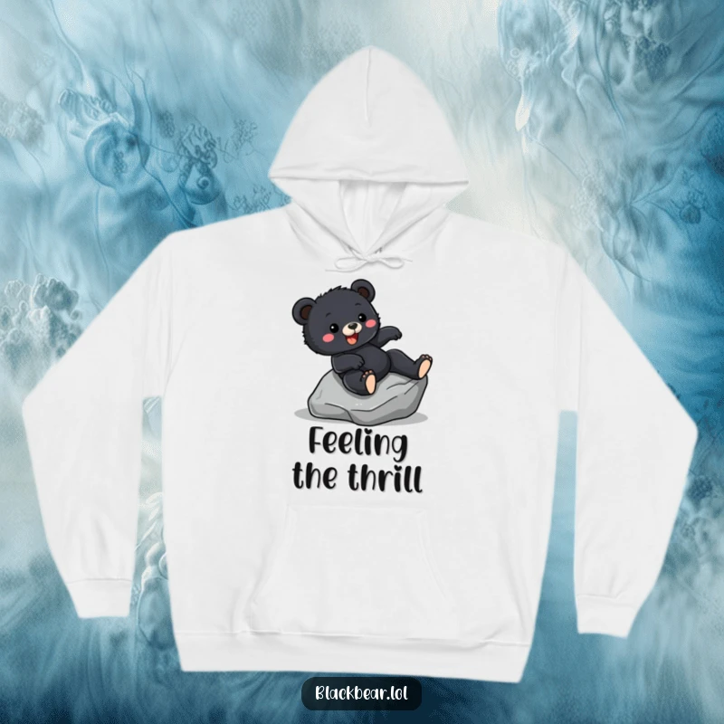 Funny Hoodie featuring a black bear cub joyfully sliding down a smooth rock, evoking a sense of fun and adventure.