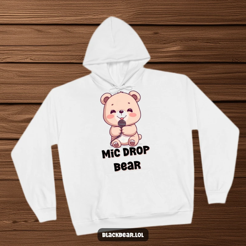 Funny Hoodie: Cute bear holding a tiny microphone, smiling joyfully, printed on a soft, warm hoodie.