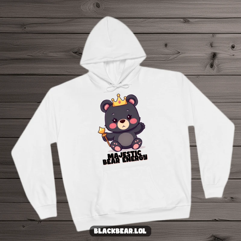 Funny hoodie featuring a cute bear cub wearing a tiny crown and holding a scepter, perfect for cozy royalty.