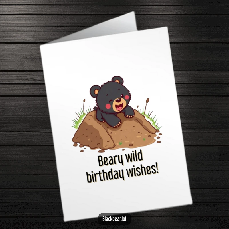 Funny Free Printable Birthday Card: Black bear cub joyfully slides down a muddy hill headfirst, covered in mud.