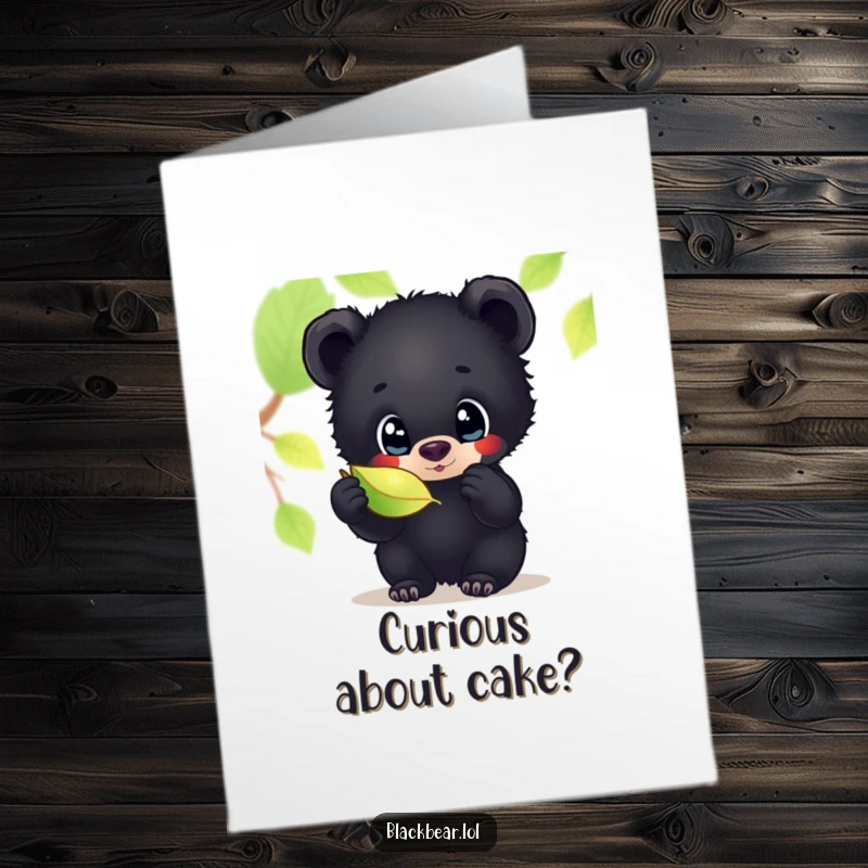 Free printable birthday card featuring a wide-eyed black bear cub captivated by the beauty of a shimmering fallen leaf.