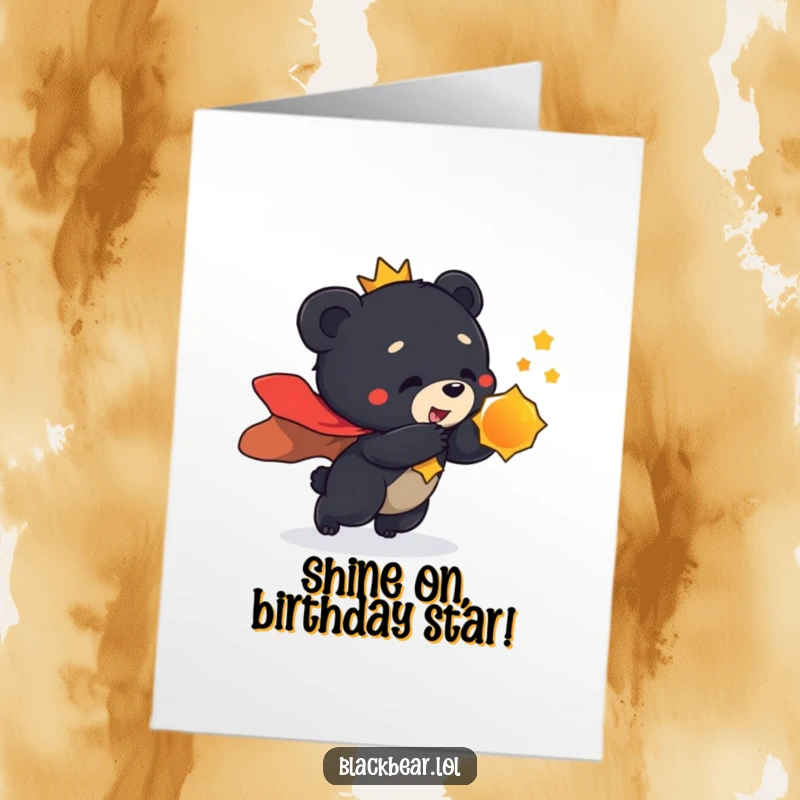 Funny Free Printable Birthday Card: A black bear cub in a regal cape lunges playfully towards a mysterious shiny object.