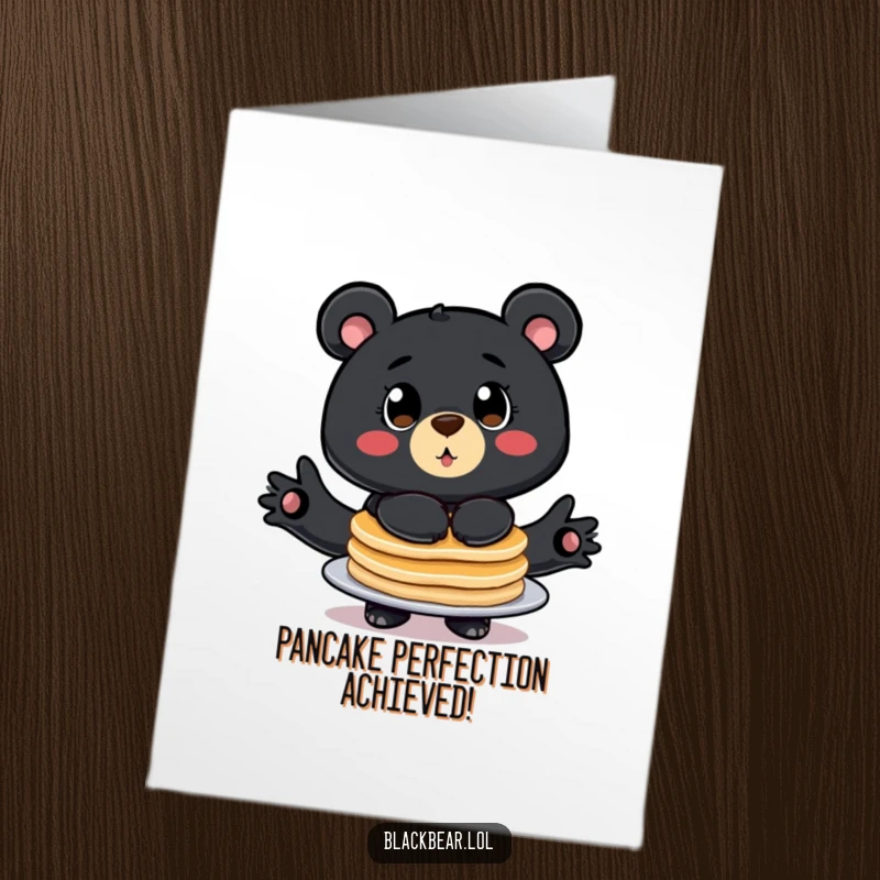 Funny Free Printable Congratulations Card: Stylized black bear with big eyes comically balancing pancakes, celebrating.