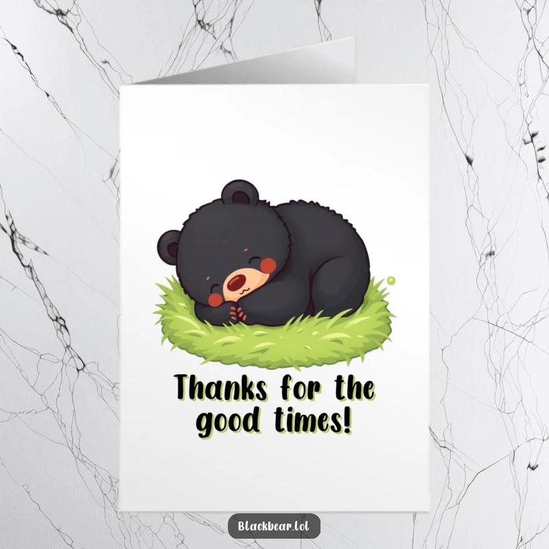 Sweet free printable thank you card of a black bear cub looking utterly content while rolling in soft moss.