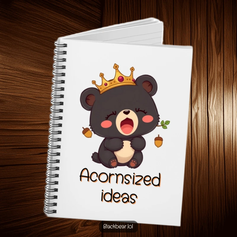 Funny notebook with a sleepy black bear cub wearing an acorn crown and yawning.