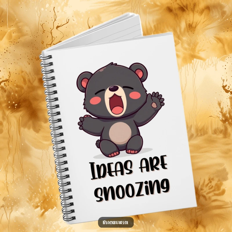 Funny notebook with a cover depicting a black bear cub yawning with a paw stretched out, perfect for journaling dreams.