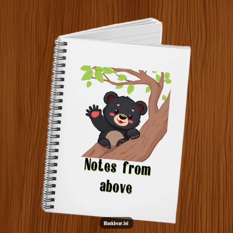 Funny black bear cub waving from a tree branch on the cover of a notebook, inspiring cheerful writing and organization.
