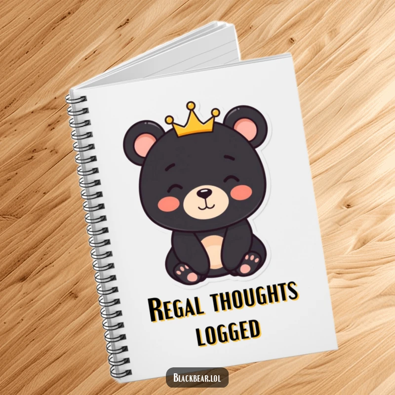 Funny black bear character with a gentle smile and a small crown, featured on a notebook cover for royal journaling.