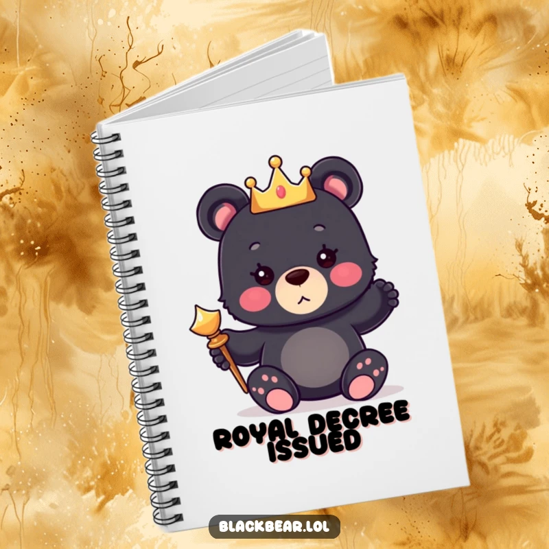 Funny notebook with a cover showing a cute bear cub wearing a tiny crown and holding a shiny scepter.