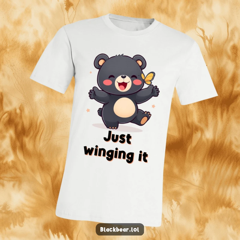 Funny t-shirt with a black bear cub joyfully dancing with a butterfly, radiating happiness and carefree spirit.