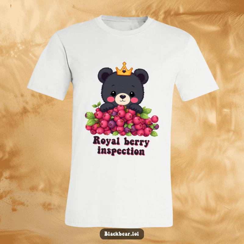 Funny t-shirt featuring a cute black bear wearing a small golden crown, peeking over a lush green berry bush, exuding playful royalty.