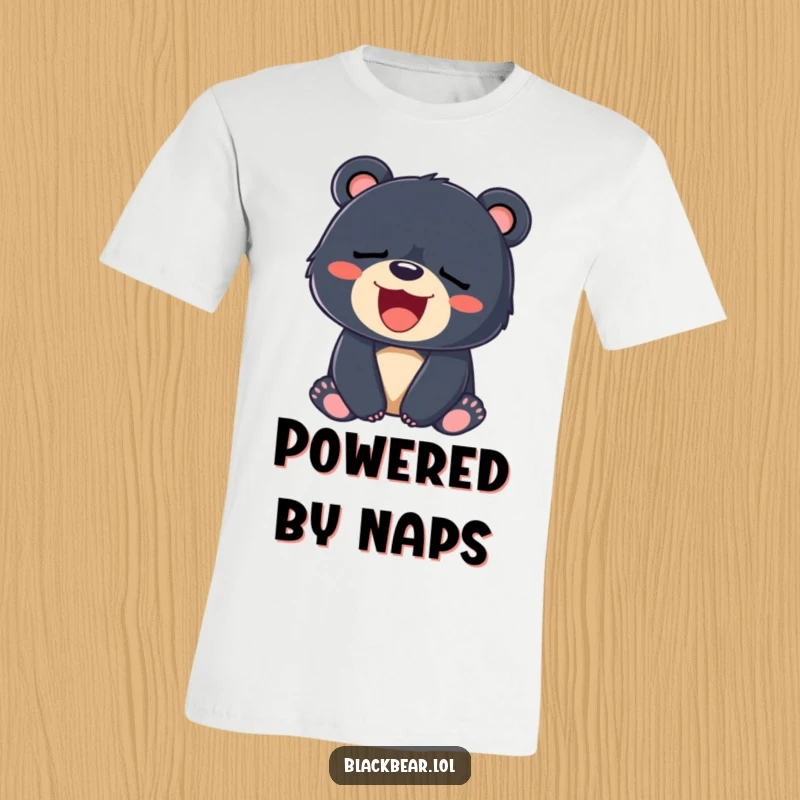 Funny t-shirt of a tired black bear cub yawning a massive, happy smile, embodying pure relaxation.