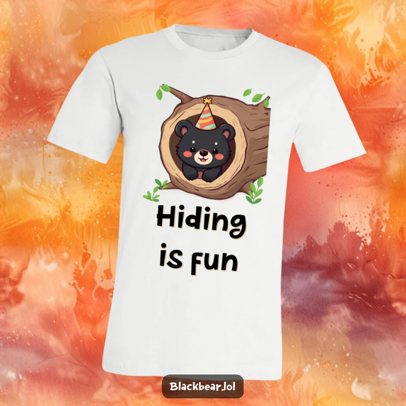 Funny t-shirt with a happy black bear cub peeking from a hollow log, wearing a party hat, embodying festive fun.