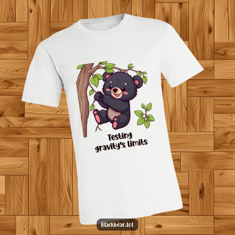Funny black bear cub t-shirt featuring a cute cub playfully tugging on a dangling vine, capturing wild innocence.