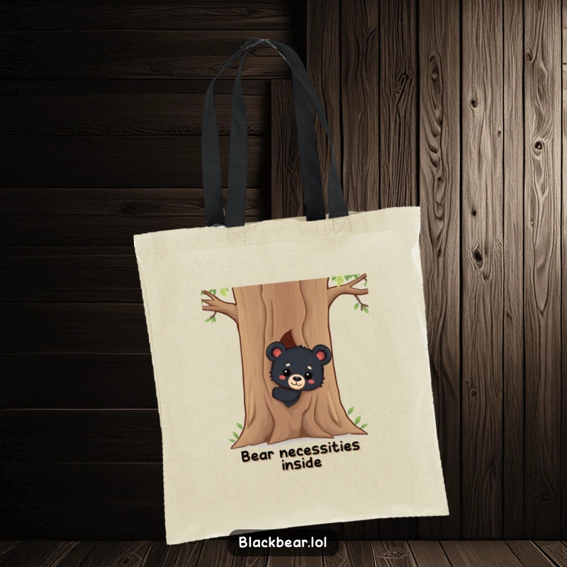 Funny Black Bear Cub Tote Bag: A delightful scene of a curious black bear cub peeking from behind a tree, perfect for carrying your items with woodland charm.