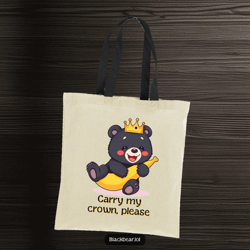 Funny crowned black bear cub tumbling over a banana peel, depicted on a durable and humorous tote bag.