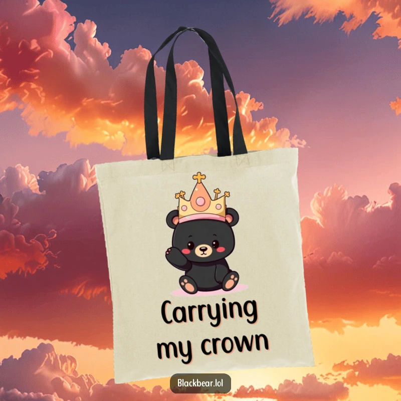 Funny tote bag showing a black bear cub hilariously attempting to wear a ridiculously large princess crown.