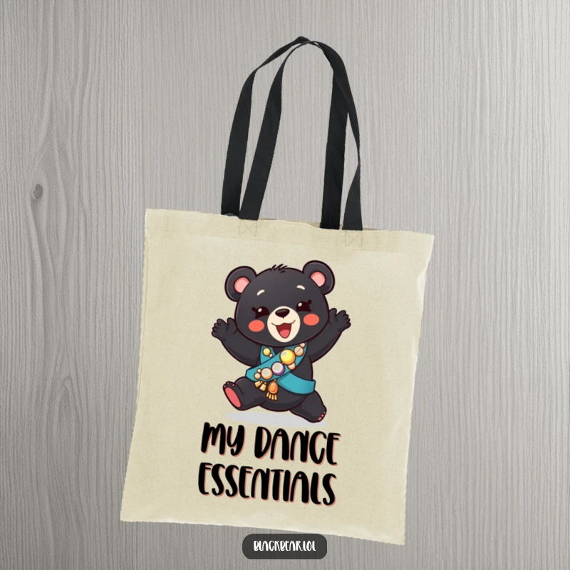 Funny tote bag featuring a black bear cub in a jeweled sash, performing a silly dance, ready for any adventure.