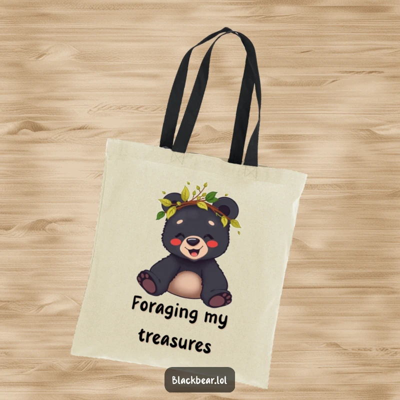 Funny tote bag with a giggling black bear cub sporting a crown of leaves and twigs, ready for any woodland adventure.